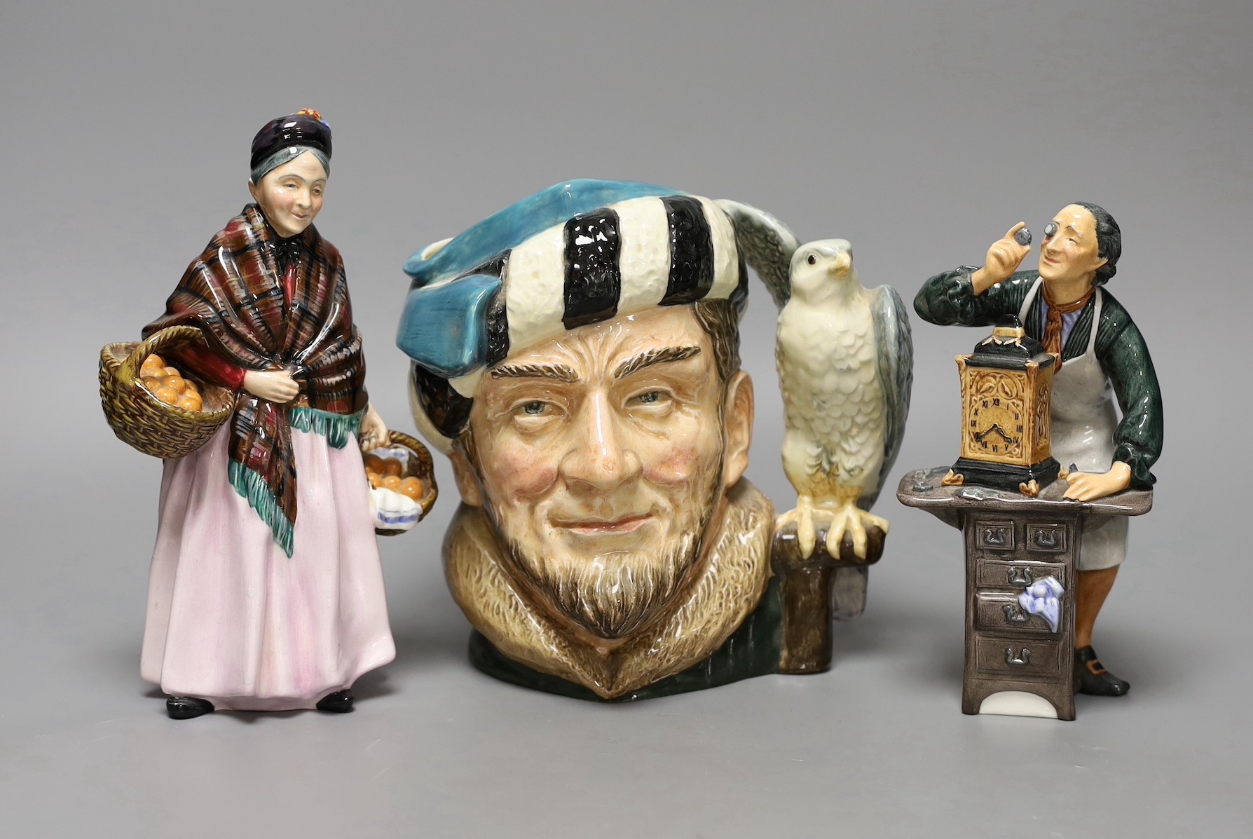 Two Royal Doulton figures, ‘The Clockmaker HN2279’ and ‘The Orange Lady HN1759’ together with a character jug ‘The Falconer D6533’